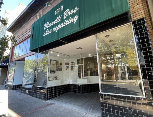 Storefront of Marelli Brothers shoe repair at 1318 Fourth Street in San Rafael, with its green awning and large front windows