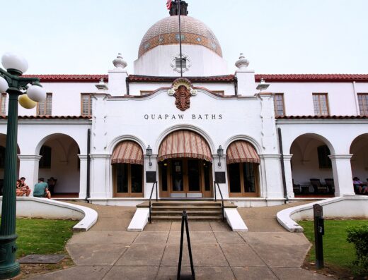Quapaw Bathhouse with its tiled dome and arched Spanish Colonial Revival facade on Bathhouse Row in Hot Springs, Arkansas